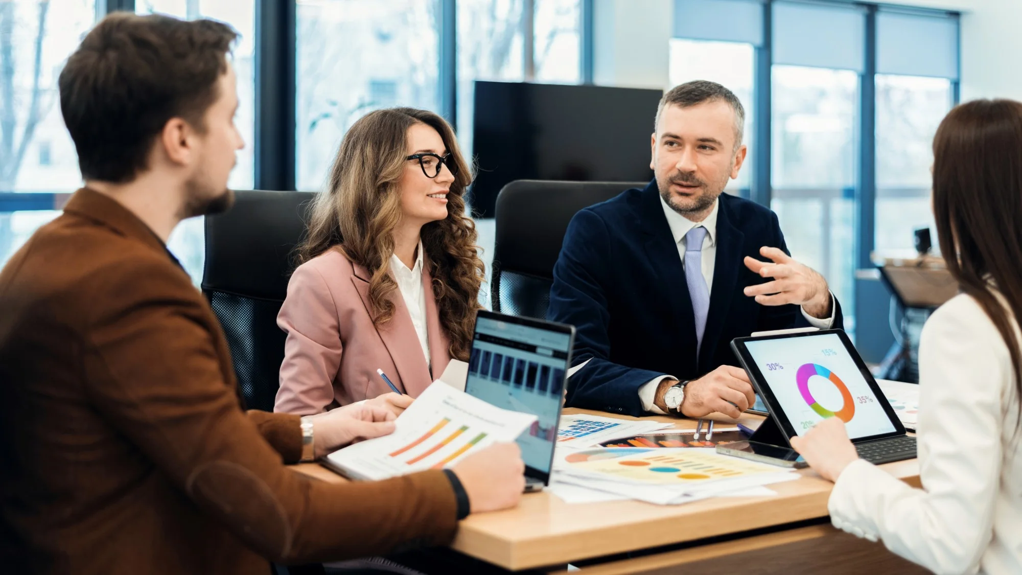 Biznexa advisers reviewing a company-formation plan with a client in the boardroom