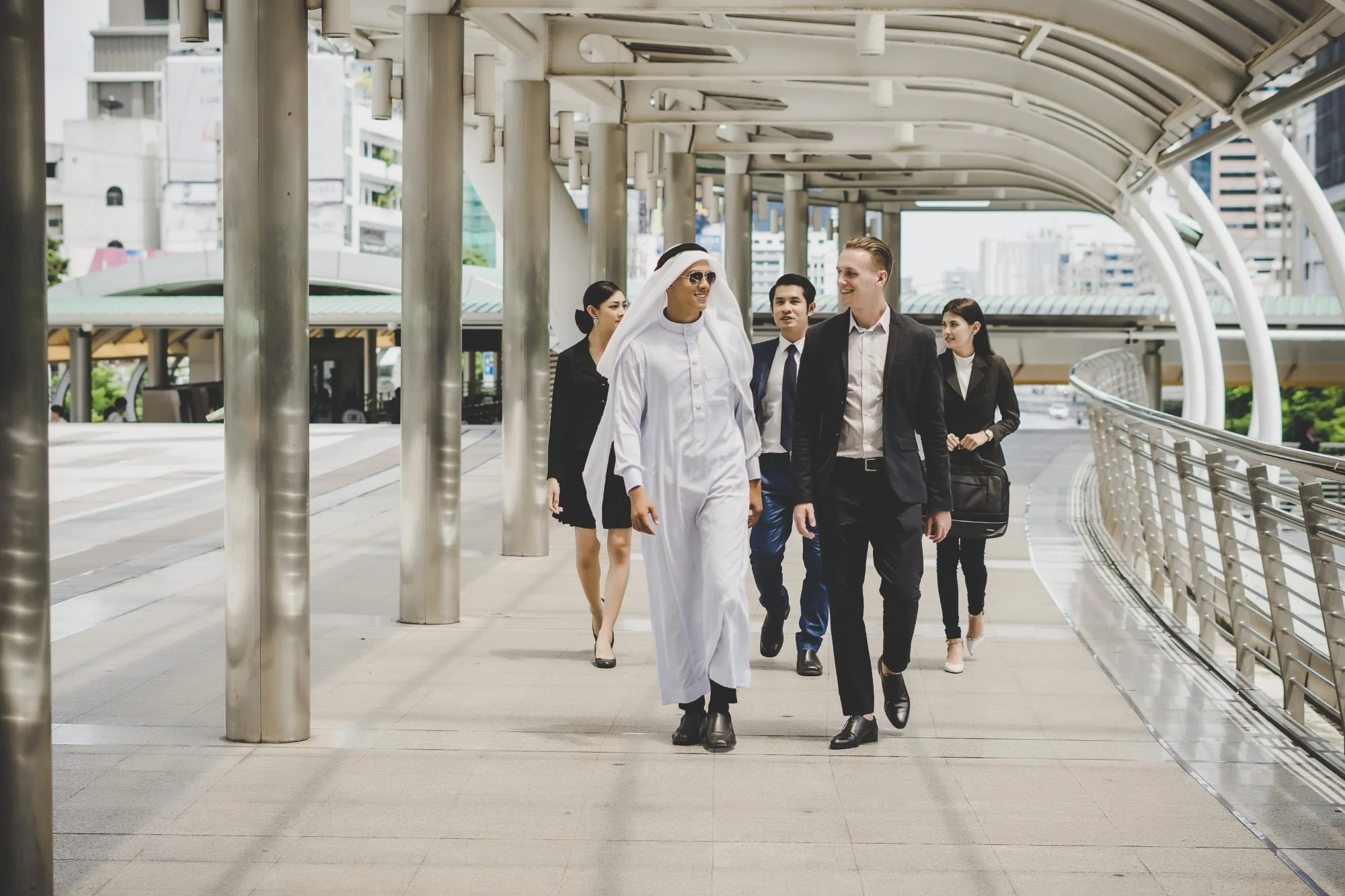 A Biznexa PRO walking with clients to a government service centre